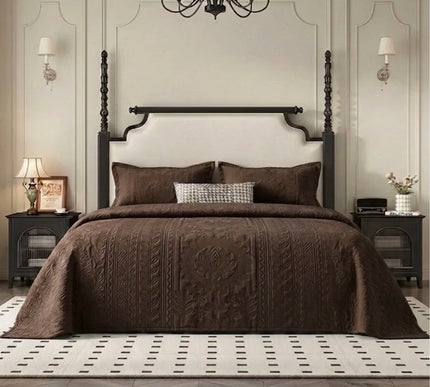 Bedroom with a large bed, dark wood headboard, and decorative elements.