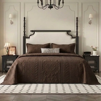 Bedroom with a large bed, dark wood headboard, and decorative elements.
