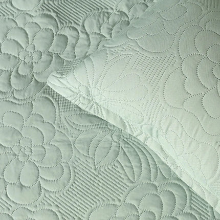 Textured fabric with floral patterns in light green color