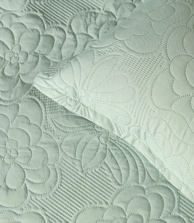 Textured fabric with floral patterns in light green color