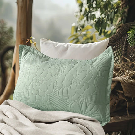 Textured green pillow on a surface with a blurred natural background