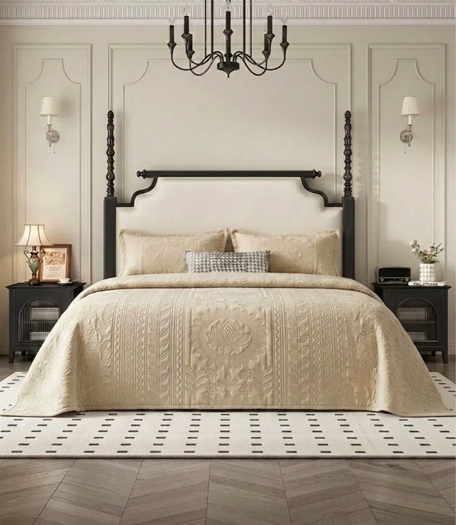Neatly made bed with beige bedding in a stylish bedroom setting.