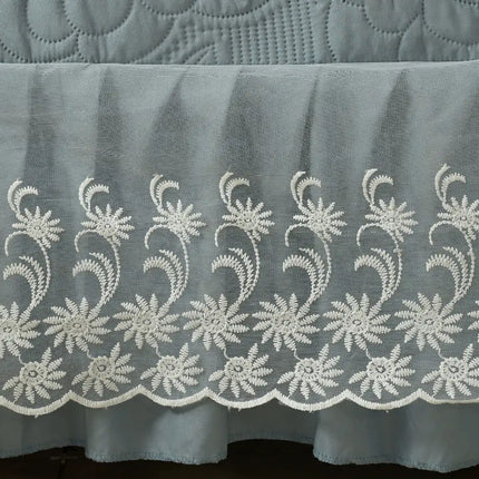 Embroidered lace trim on a fabric background
