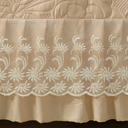 Beige fabric with intricate white lace pattern