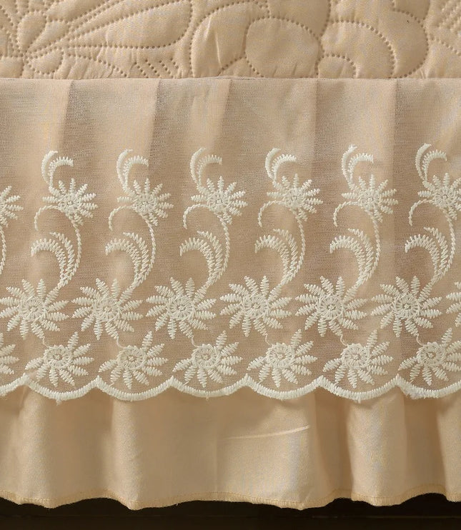 Beige fabric with intricate white lace pattern