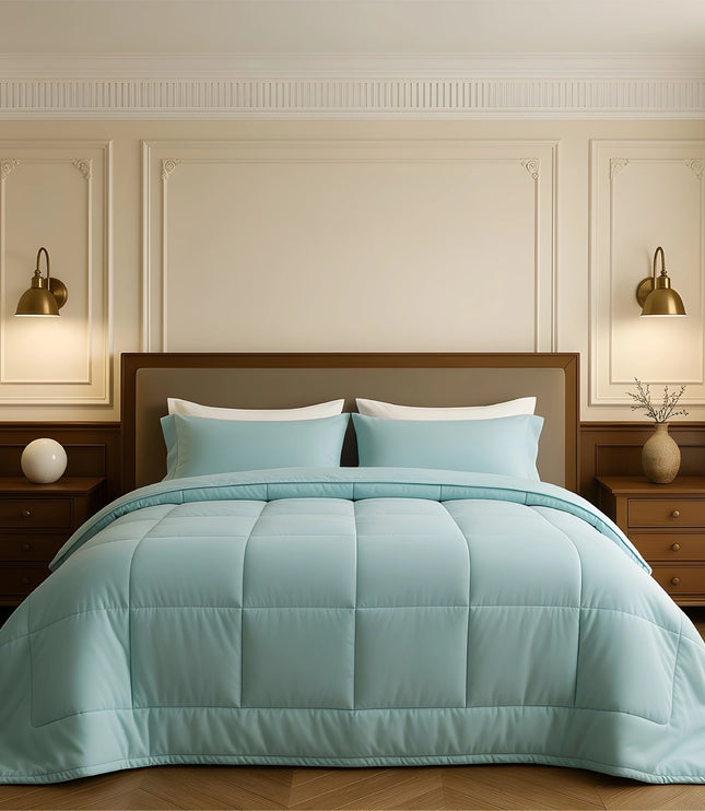 Bedroom with a neatly made bed featuring sky blue bedding and wooden furniture.